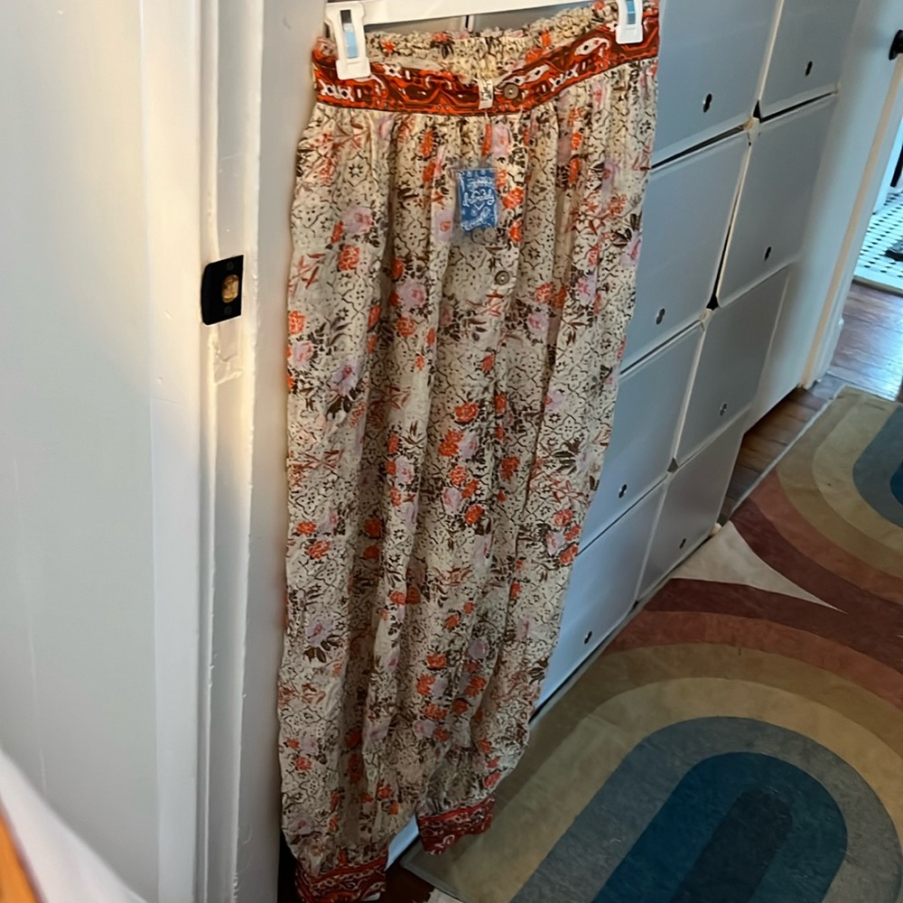 Great cover up pants light floral with pops of orangey pink